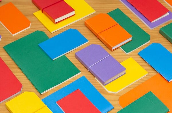 Brightly colored lab notebooks