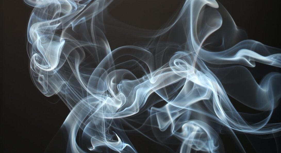 Smoke against a black background.